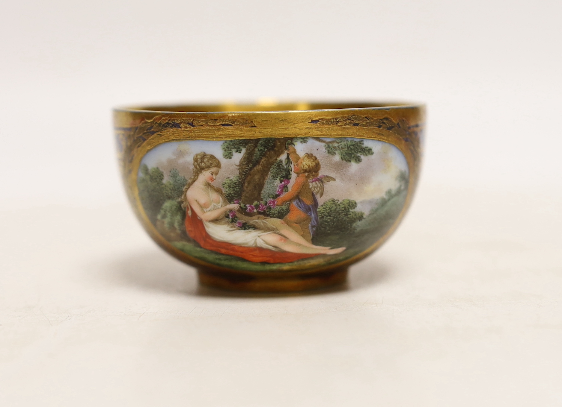 A Meissen Marcolini period cabinet cup, hand painted with figures beneath a tree and gilded interior, crossed sword mark to the base, 8.5cm wide